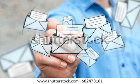 Businessman on blurred background drawing manuscript contact icon with a pen