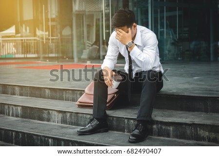 People unemployed businessman stress sitting on stair, concept of business failure and unemployment problem. Royalty-Free Stock Photo #682490407