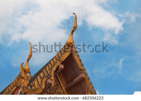 The roof of Thai temple style with blue sky beautiful.