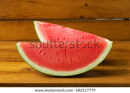 Fresh and sweet watermelon slices on a wooden table