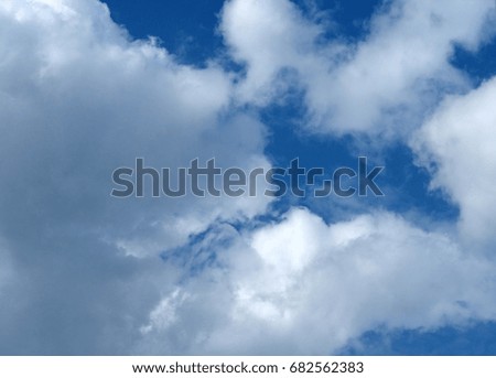 Big white clouds against blue sky