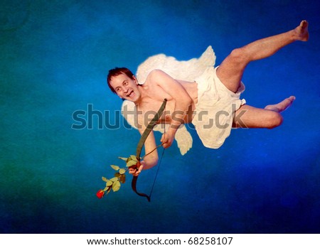 Cupid with wings and hearth shaped arrow on vintage postcard
