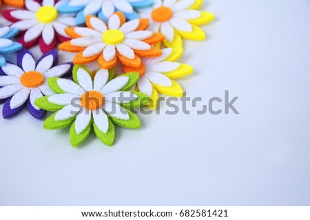 Images of flowers made of colorful felt fabrics. Isolated on white background.