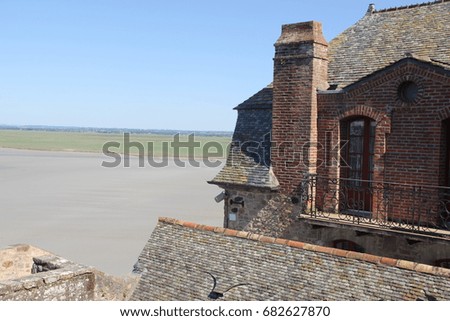 Stone house with sea in background