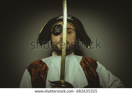 Character, Man with beard dressed like a pirate, with eye patch and steel sword