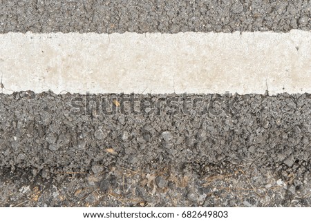 old white line asphalt road, closeup
