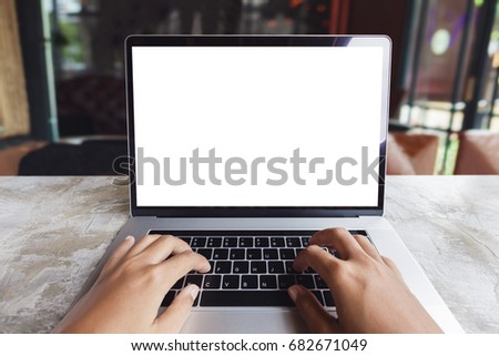 close-up hand typing keyboard computer in coffee shop Royalty-Free Stock Photo #682671049