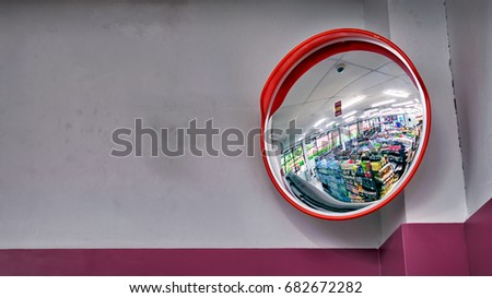Round Security Mirror on top of The Corner in a Convenient Store