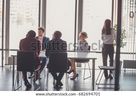 startup business, young creative people group entering meeting room, modern office interior