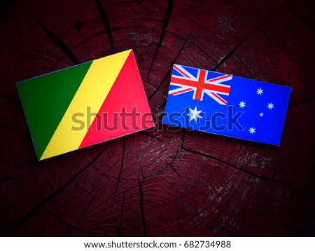 Republic of the Congo flag with Australian flag on a tree stump isolated