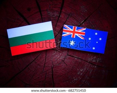 Bulgarian flag with Australian flag on a tree stump isolated