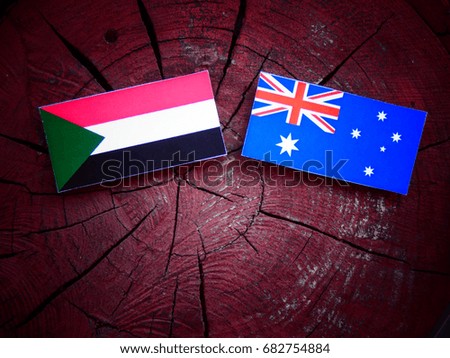 Sudan flag with Australian flag on a tree stump isolated