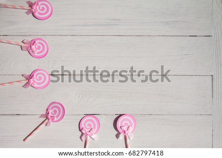 Lollipops sweets, pink woman concept. Candy, top view flat lay on white wood background. Sweet , lollipop, candy, mock up