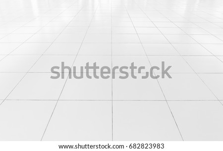 White tile floor clean and symmetry with grid line texture in perspective view for background. Flooring permanent covering by tile, Square shape of white tile made from ceramic material covering floor