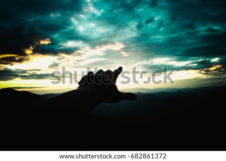 Reach out to grab the sunshine in dark tone ,Amidst mountains