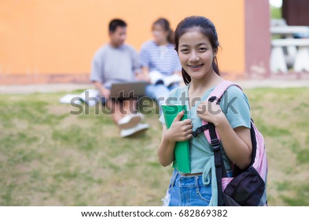 A portrait of an Asian college student on campus
