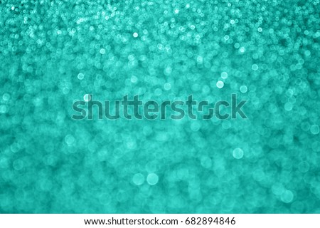 Abstract sparkly teal green glitter sparkle confetti background for turquoise happy birthday party invite, aqua mint bridal card, baby shower announcement, engagement, or defocused Christmas bokeh Royalty-Free Stock Photo #682894846