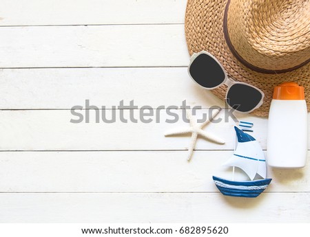 Summer Fashion woman big hat and accessories in the beach. Tropical sea.Unusual top view, colorfull background.  Summer Concept
