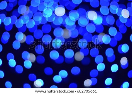 Blue and white defocused lights producing bokeh