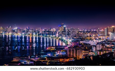 The bay and skyscrapers in twilight time and midnight time in Pattaya, Thailand. Pattaya city is famous for sea sport and night life entertainment. Royalty-Free Stock Photo #682930903