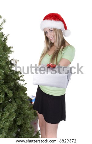 woman holding christmas gifts over white background