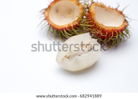 Tropical fruit called "rambutan" on white isolated background