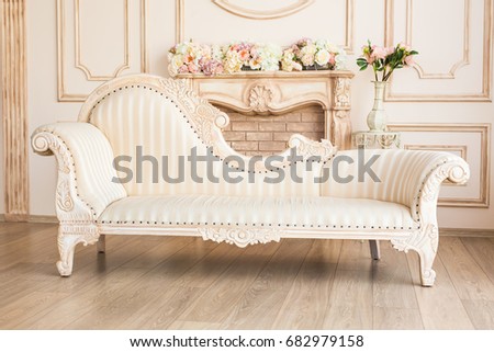 Classic White Interior Of Living Room With Sofa And Armchair Near Fireplace. Royalty-Free Stock Photo #682979158