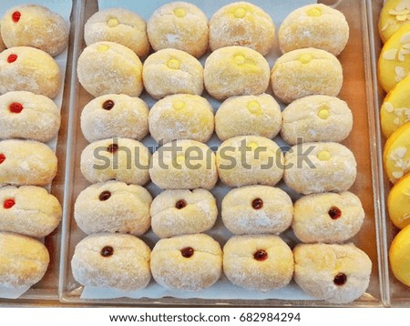 doughnuts filling on shelf.