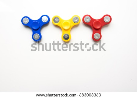 Hand Spinner. Stress relieving toy on white background. Close-up. Top view. Stock photo