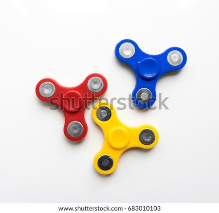 Hand Spinner. Stress relieving toy on white background. Close-up. Top view. Stock photo