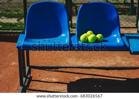 Tennis balls on the seats