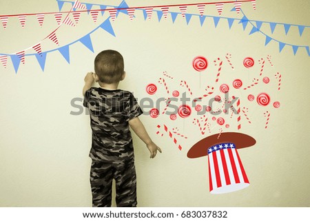 Concept of useful baby food. The little boy draws a sweet tooth on the wall. Fantasy for children. Photo illustration for your design.