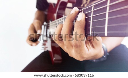 A man playing electric guitar