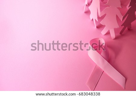 Sweet pink ribbon shape with girl paper doll on pink background  for Breast Cancer Awareness symbol to promote  in october month campaign Royalty-Free Stock Photo #683048338