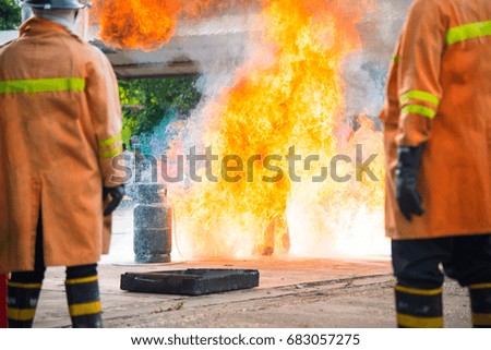 firefighter in park with fire on trianing.