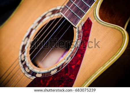 acoustic guitar on black background.concept for musical instrument background