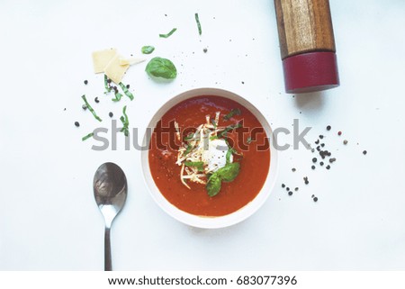healthy creamy tomato soup with ricotta, cheese and fresh herbs