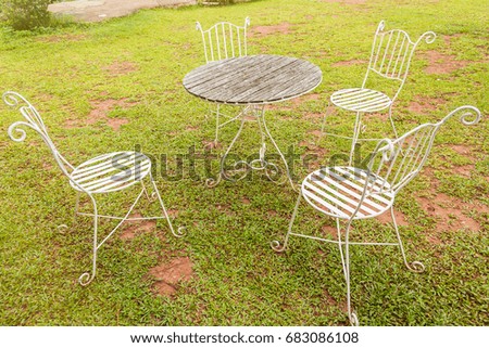 White chair and table steel on the lawn