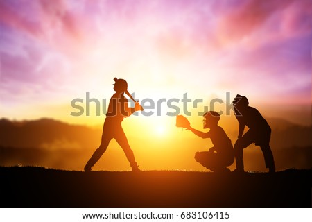 Silhouette of Softball Player on Sunset Background