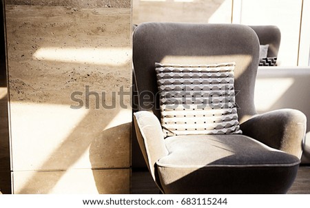 photo of beautiful armchair close to the wall