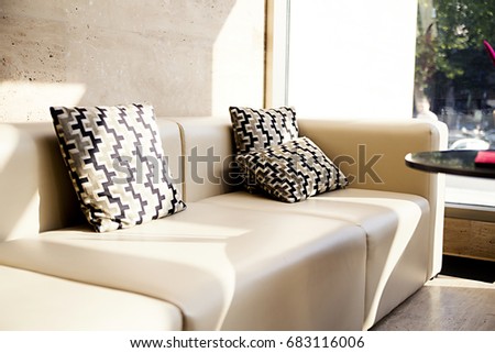 photo of White leather sofas in the hall