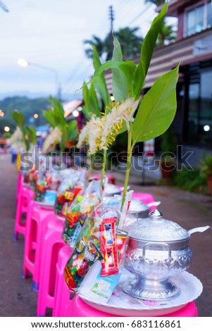 Set dry food and rice cook prepare for monk on morning activity.Put on pink chair and Myanmar flowers.