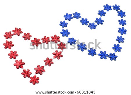 Two red and blue hearts from snowflakes on white