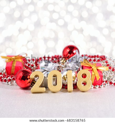 2018 year golden figures and Christmas decorations on a bokeh background