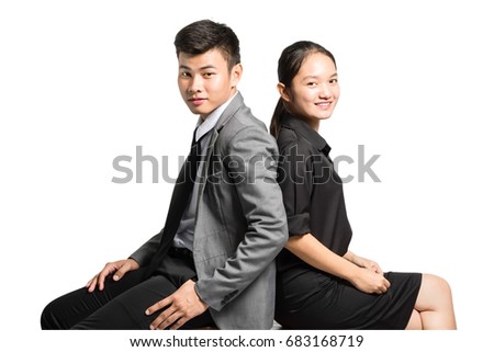 portrait of asian couple in love sitting on the chair and smiling. Isolated on white background with copy space