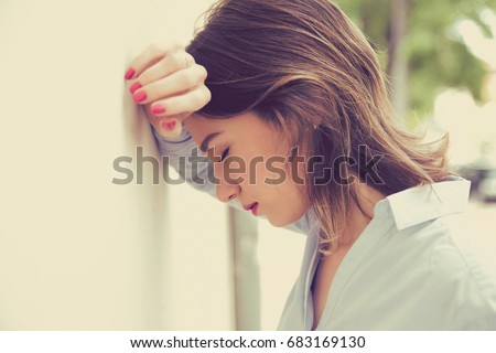 portrait stressed sad young woman outdoors. City urban life style stress  Royalty-Free Stock Photo #683169130