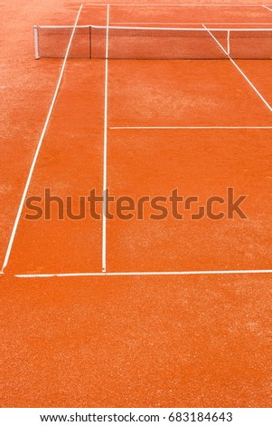 Cropped view of empty, red clay, tennis court
