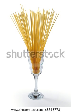 "picture of wheat spaghetti with glass of it digs and white bottom      "