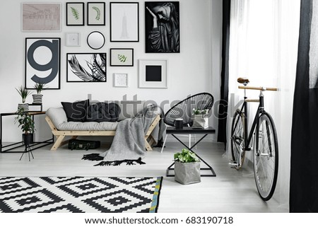 Old-fashioned bike in spacious modern decorated lounge