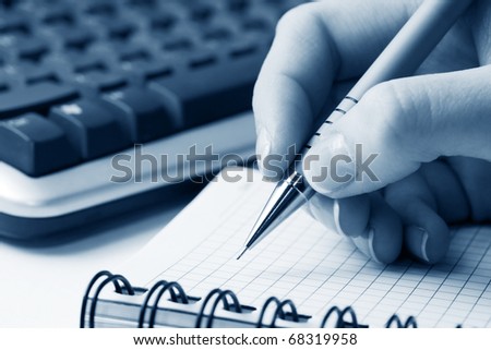 Female hands writing.